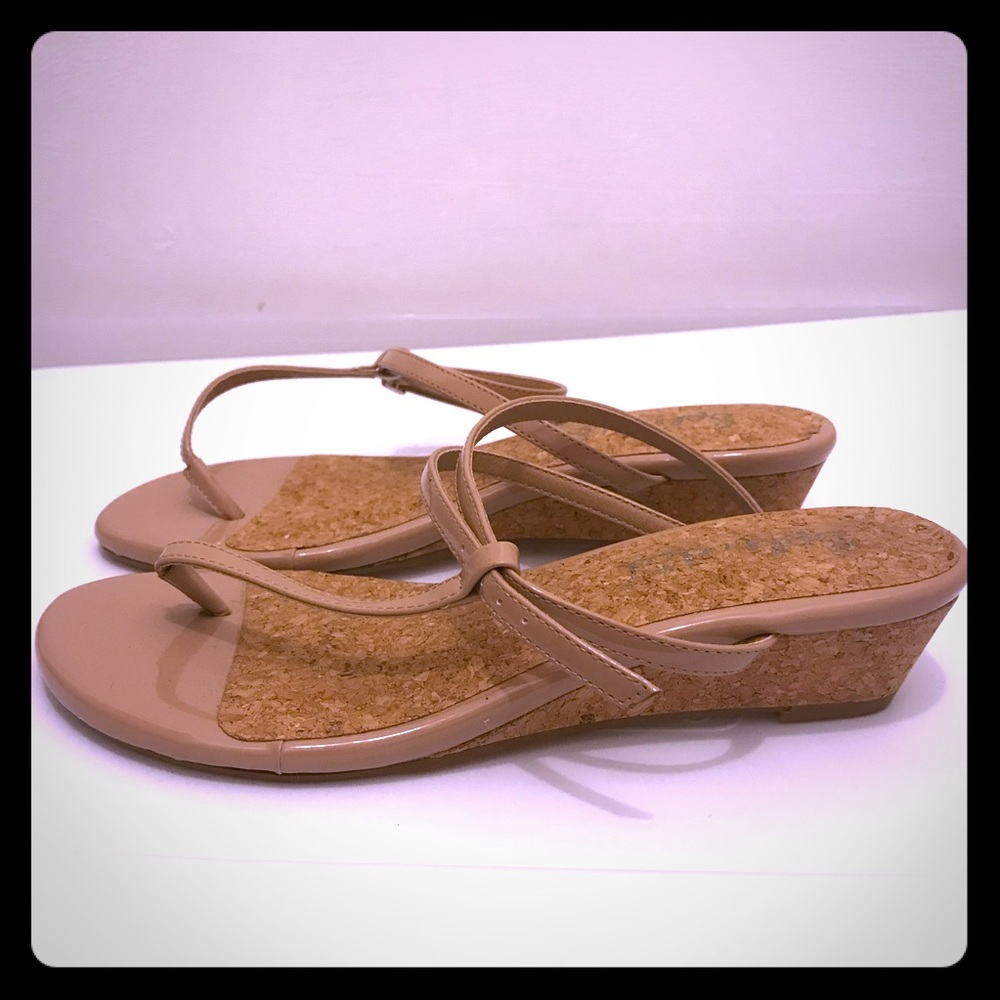 Size 7.5 Tan wedges.  Heel 1.5in with ankle straps